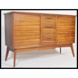 Alfred Cox - A  vintage 20th century oak sideboard credenza having a central bank of 3 drawers