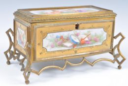 A 19TH CENTURY SEVRES MANNER CERAMIC PANELLED JEWELLERY CASKET