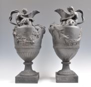 A PAIR OF LARGE 19TH CENTURY WEDGWOOD BLACK BASALT WATER JUGS.