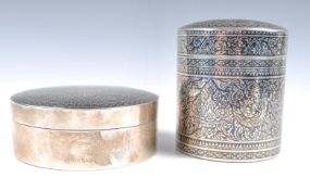 TWO EARLY 20TH CENTURY THAI NIELLO SILVER CYLINDRICAL POTS.