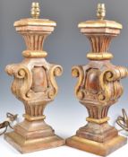 A pair of large 18th Century style Italian hand carved wooden table lamps raised on stepped square