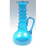 18TH CENTURY FRENCH BLUE GLASS BOTTLE WITH APPLIED HANDLE.