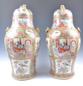 LARGE PAIR OF 19TH CENTURY CHINESE TEMPLE VASES AND COVERS.