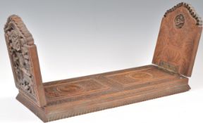 A 19TH CENTURY CHINESE HARDWOOD EXTENDING BOOKSTAND.