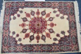 AN EARLY 20TH CENTURY PERSIAN WHITE GROUND CARPET RUG.