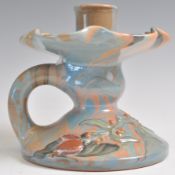 AN EARLY 20TH CENTURY ELTON WARE MARBLE GLAZE CHAMBERSTICK