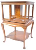 19TH CENTURY SATIN WOOD REVOLVING BOOKCASE ON STAND.