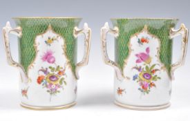 A PAIR OF EARLY 20TH CENTURY DRESDEN THREE HANDLED VASES