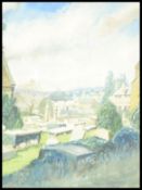 A 20th Century watercolour painting on paper depicting the view across a graveyard with a town