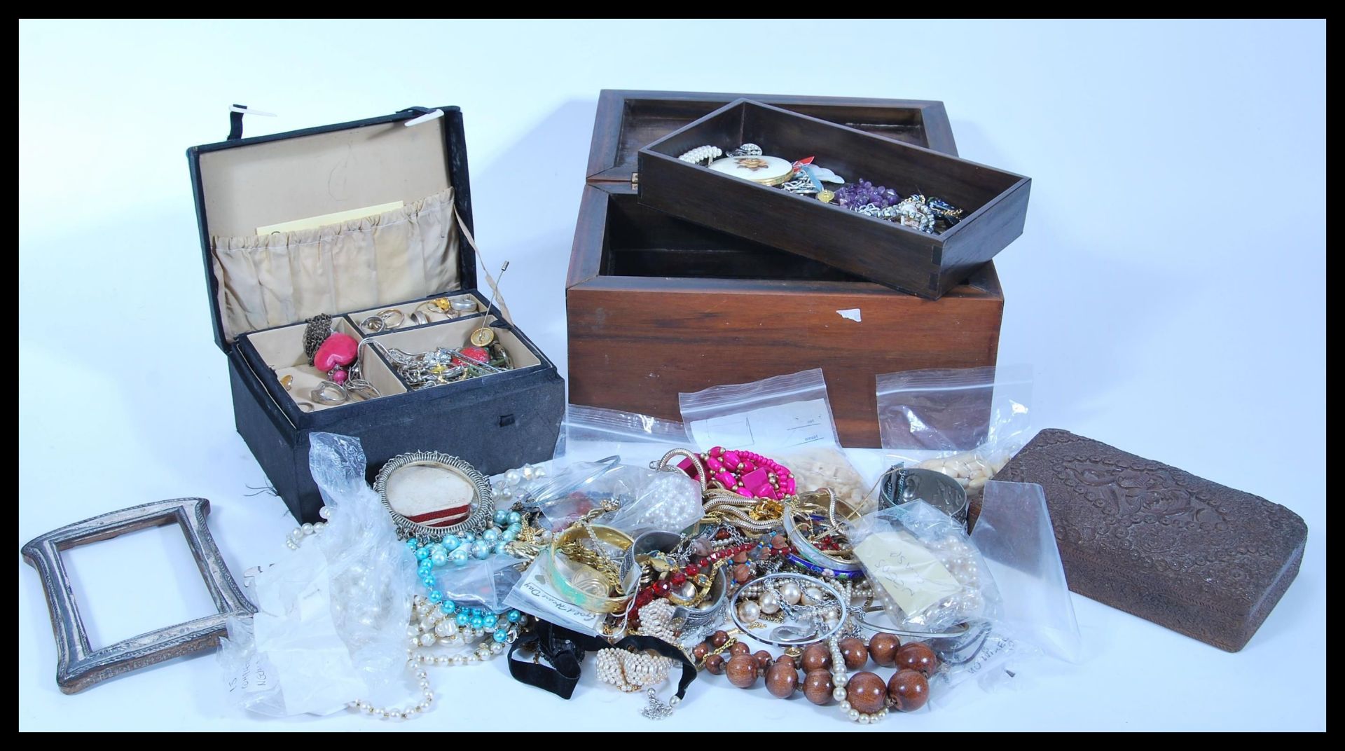 A large collection of vintage costume jewellery to include simulation pearl and beaded necklaces,