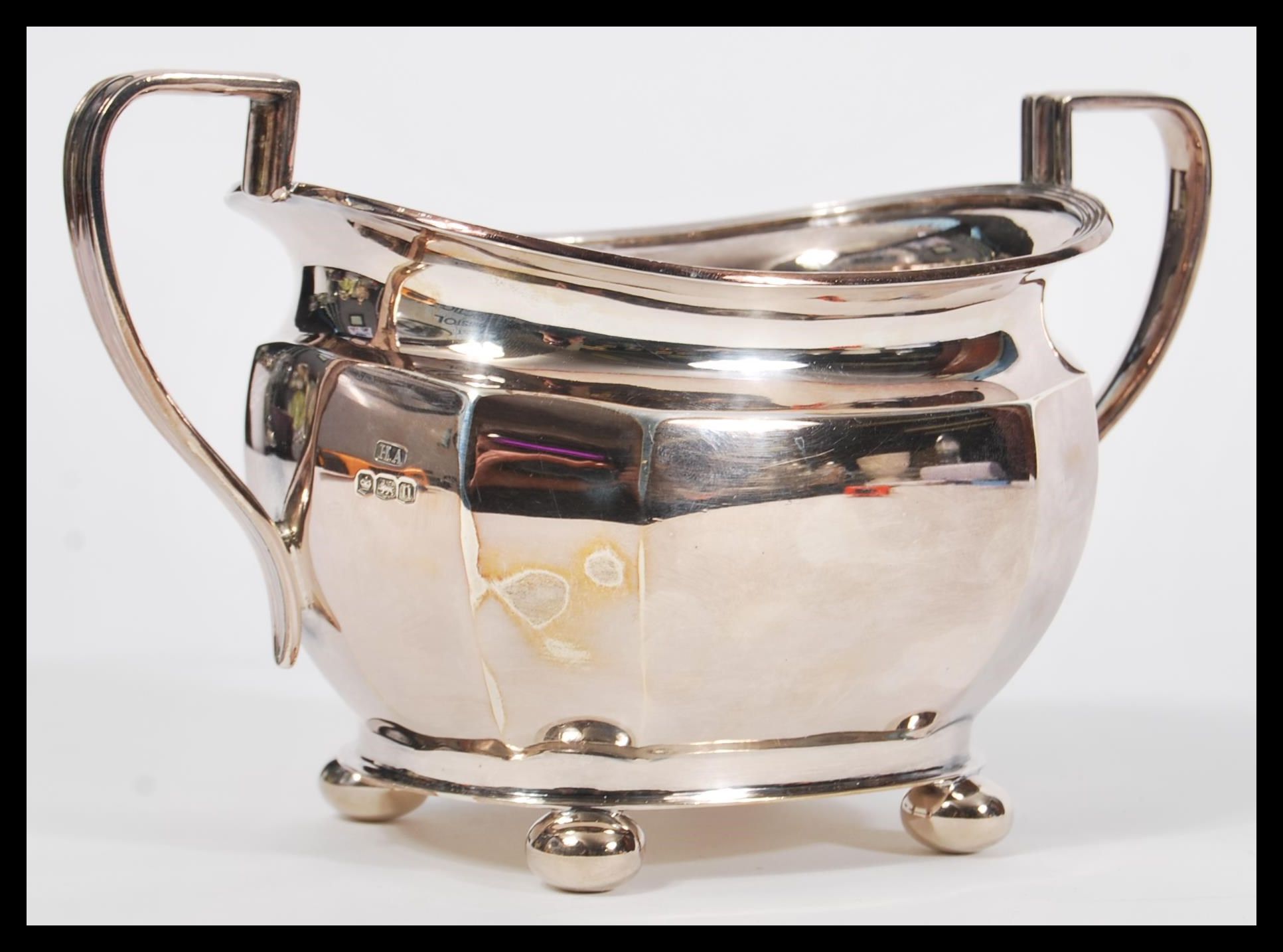 An early 20th Century hallmarked silver sugar bowl by Atkin Brothers raised on four bun feet with - Image 2 of 5