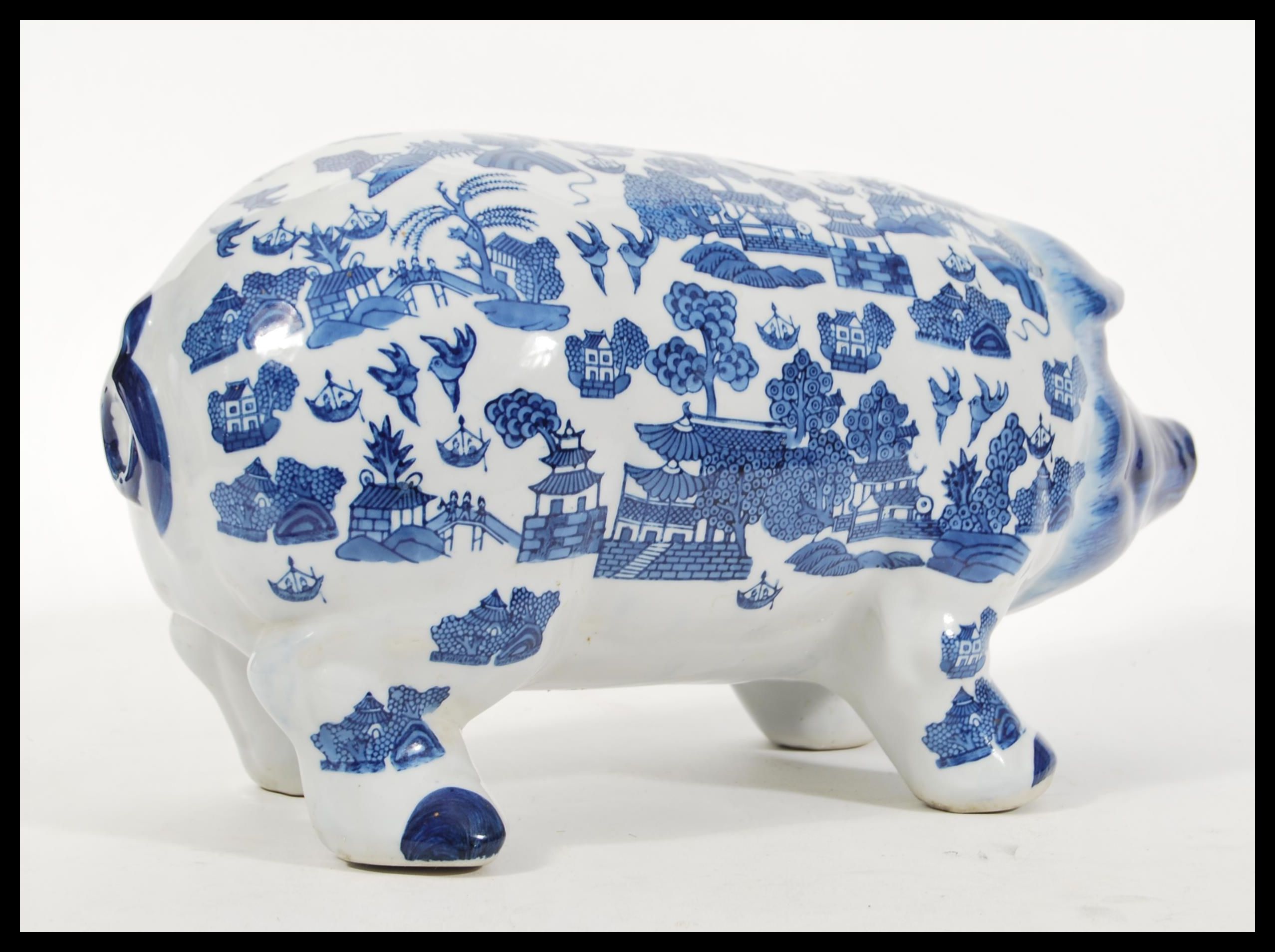 A vintage 20th Century large ceramic money bank box in the form of a pig having blue and white - Image 2 of 4