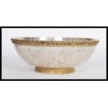 A sterling silver 925 stamped centerpiece bowl raised on an embossed gilded foot with decorative