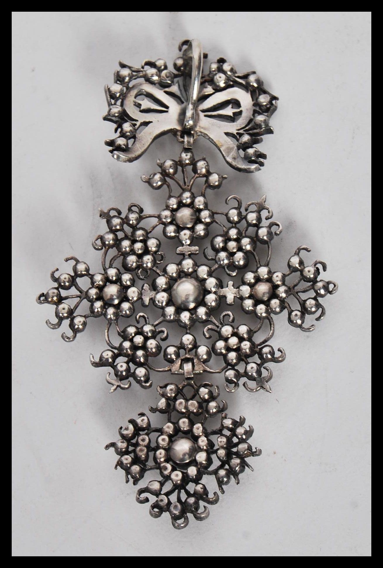 A late 19th / early 20th Century silver pendant, set with marcasites and pink paste in a floral - Image 3 of 3