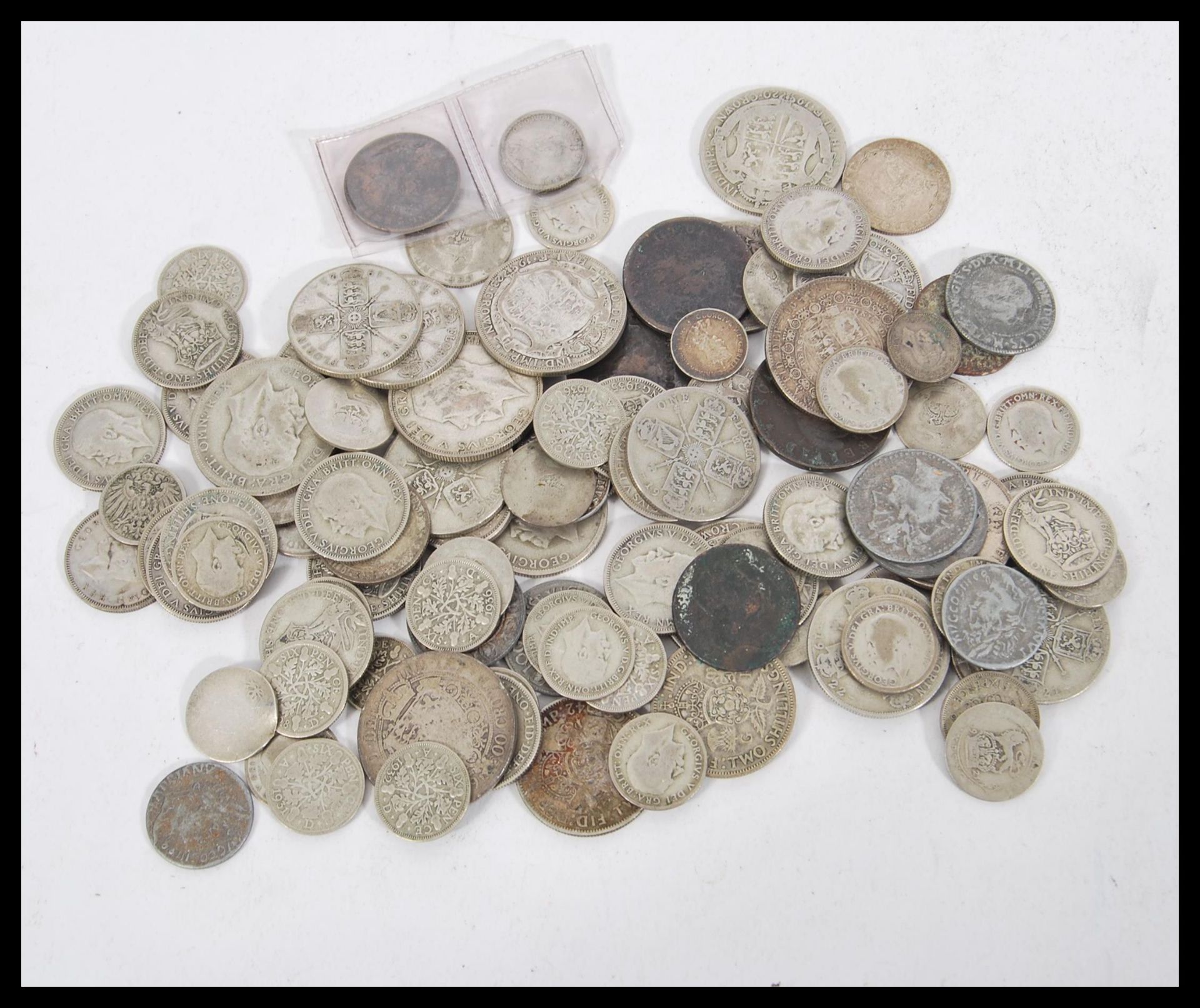 A collection of coins dating from the 19th Century to include silver and half silver coins including