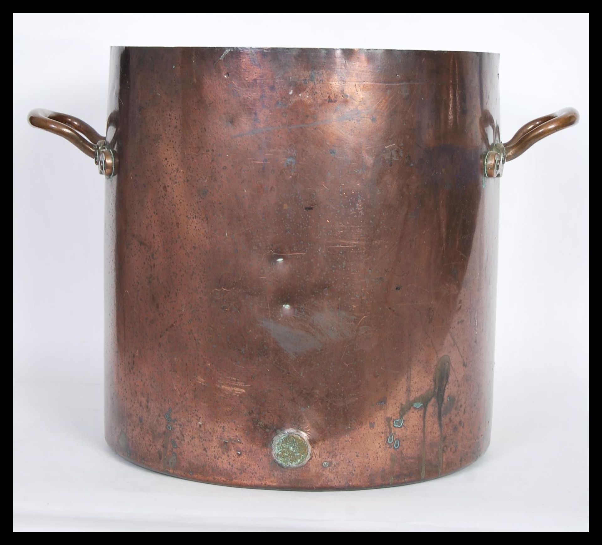 A large 19th Century Country House copper pan of tall form having cylindrical body with shaped