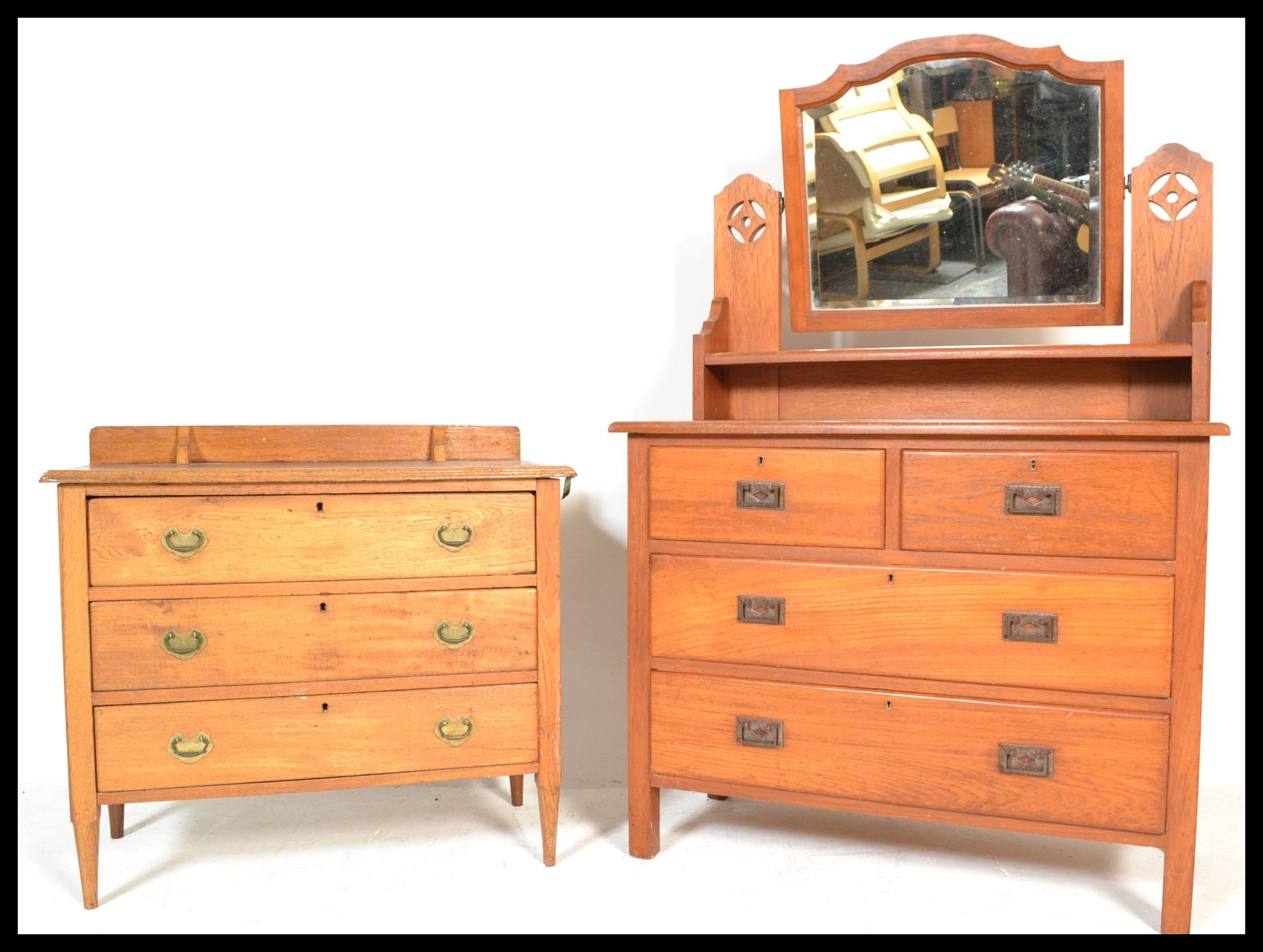 An early 20th Century oak dressing table chest having adjustable mirror over chest of drawers base