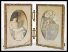 An early 20th Century Edwardian folding desk picture frame including the photographs of a husband