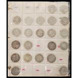 A collection of coins across two albums containing Victorian and early 20th Century silver and