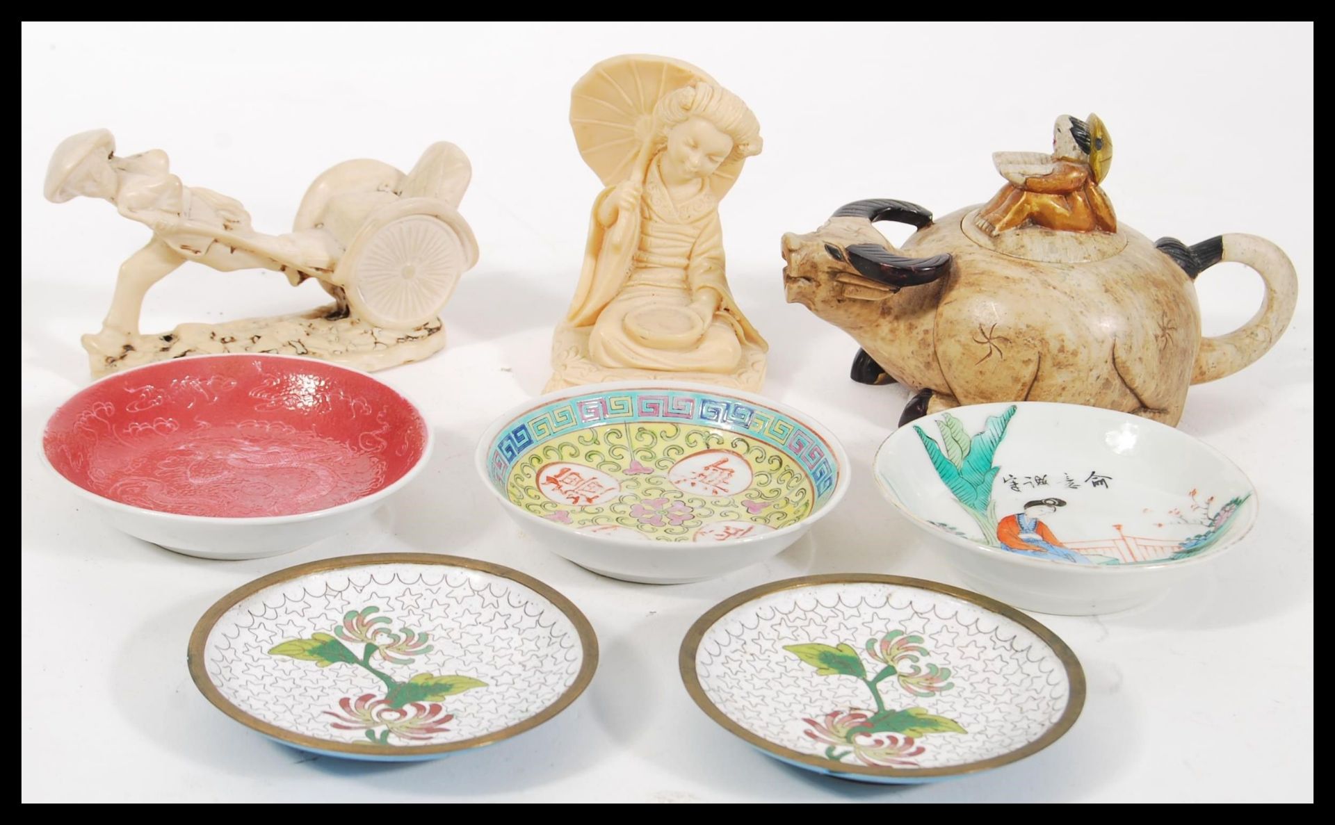 A collection of Chinese and Oriental wares to include a porcelain Yixing teapot in the form of an Ox