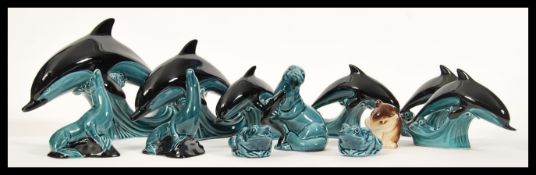 A collection of Poole pottery ceramic figurines having a blue glaze in the form of animals to