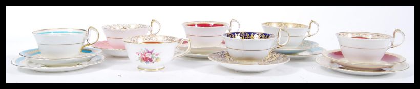 A collection of 20th Century Aynsley Fine English Bone China cups and saucers to include four cup