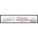 A collection of 20th Century Aynsley Fine English Bone China cups and saucers to include four cup