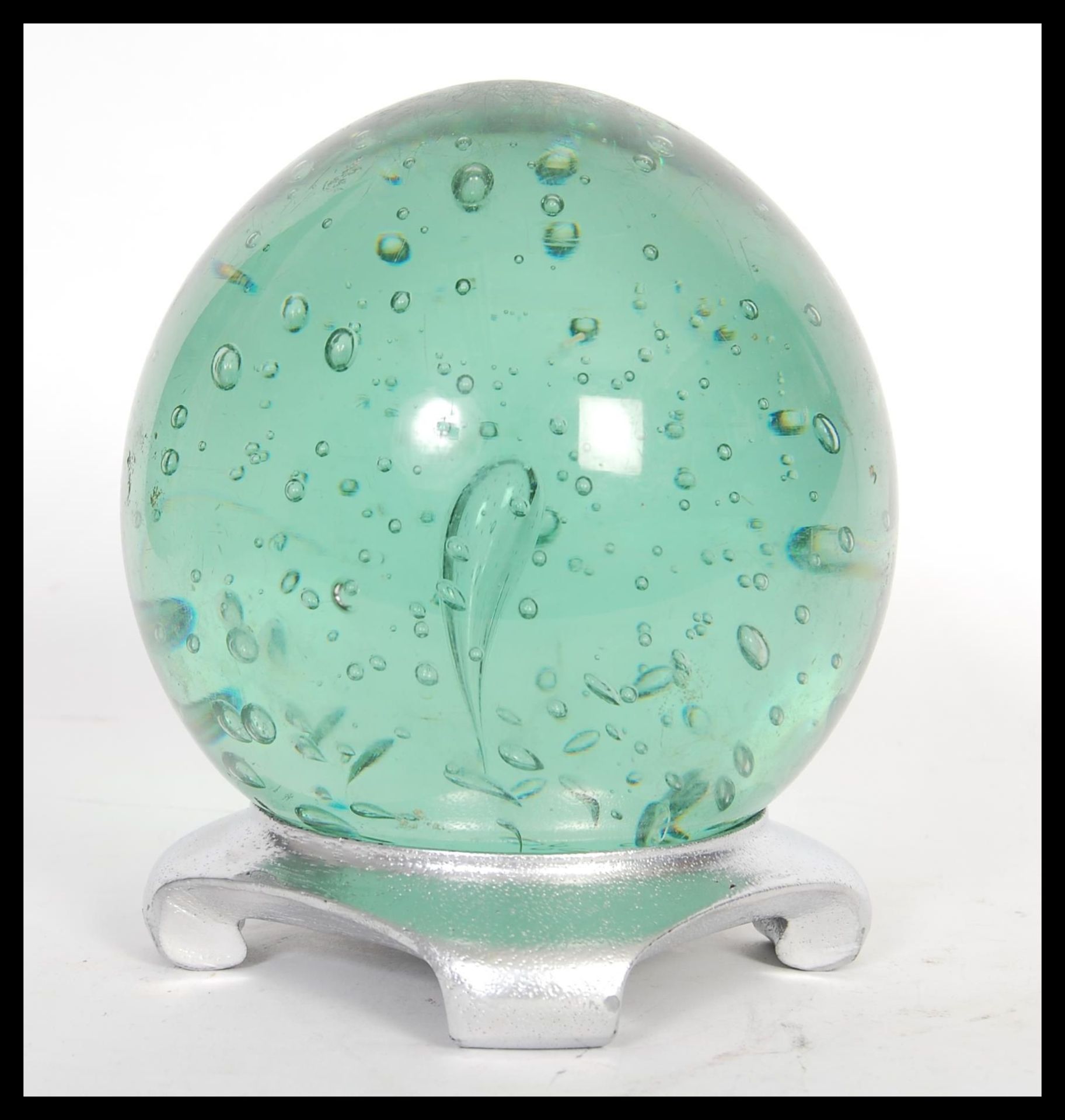 A large 19th Century Victorian Nailsea green glass paperweight dumb of bulbous form having large