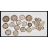 A selection of silver coins mostly dating from the Victorian era to include an 1899 half crown, a