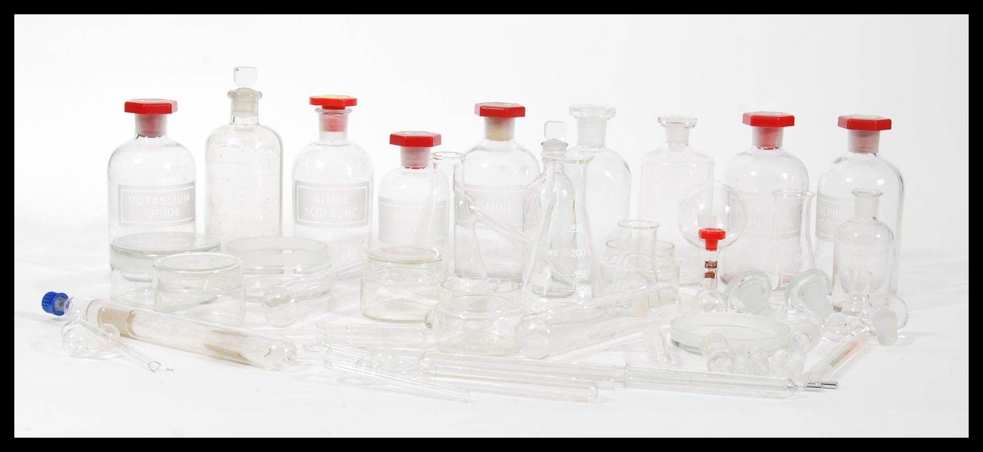 A collection of vintage retro 20th Century scientific lab glass to included lidded chemical