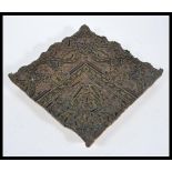 An antique 19th century Victorian printers wood block, heavily carved applied brass to form an