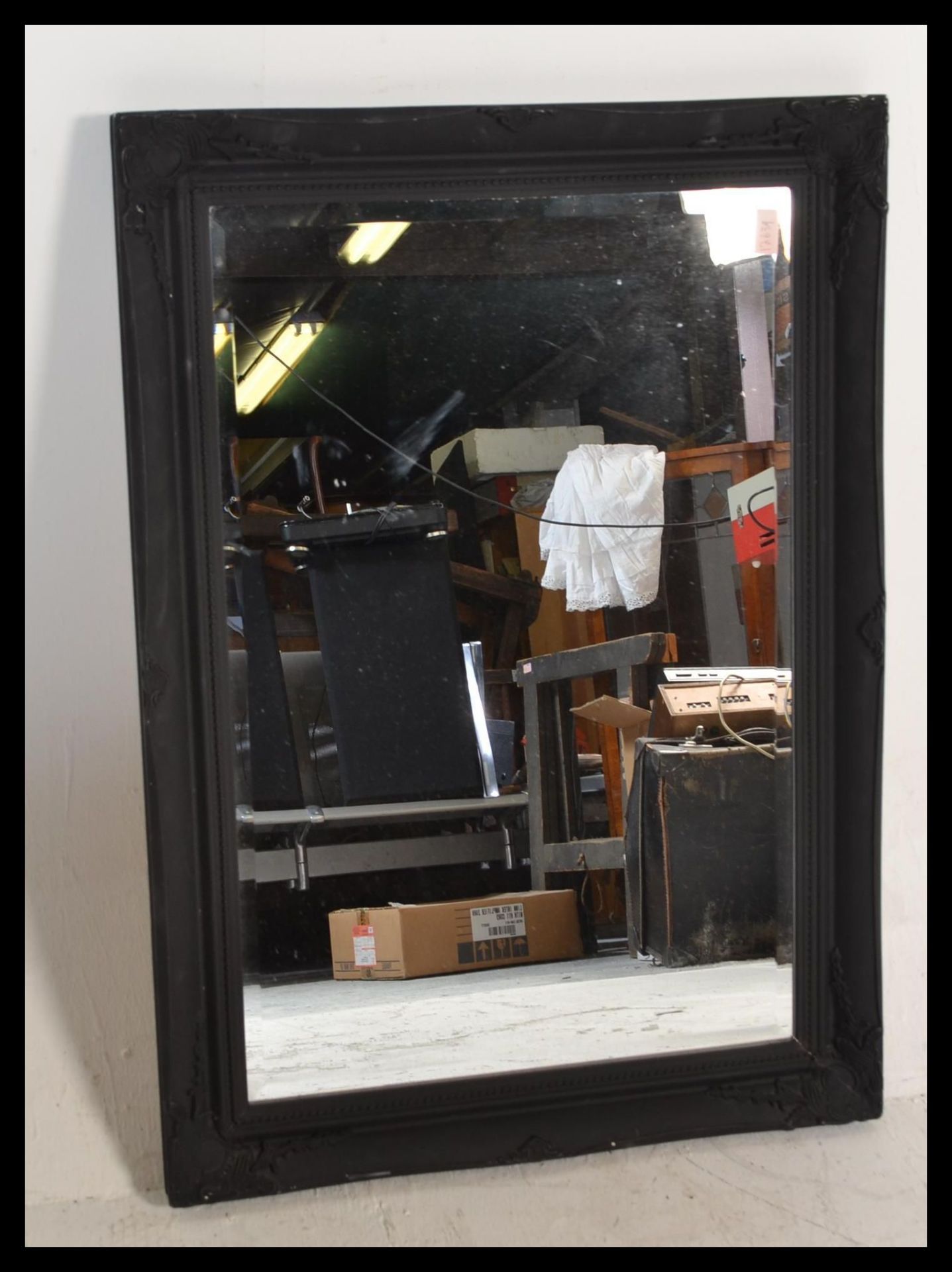A antique style large ornate bevelled glass mirror set to an ebonised frame with scroll and leaf - Bild 4 aus 5
