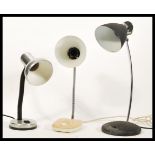 A group of three vintage retro 20th Century industrial table desk anglepoise type lamps to include a