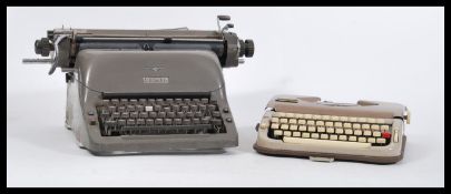 Two vintage retro 20th Century industrial typewriters to include an Adler example and a smaller