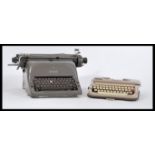 Two vintage retro 20th Century industrial typewriters to include an Adler example and a smaller