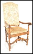 An English walnut carver dining chair in the manner of Daniel Marot. The chair having carved and