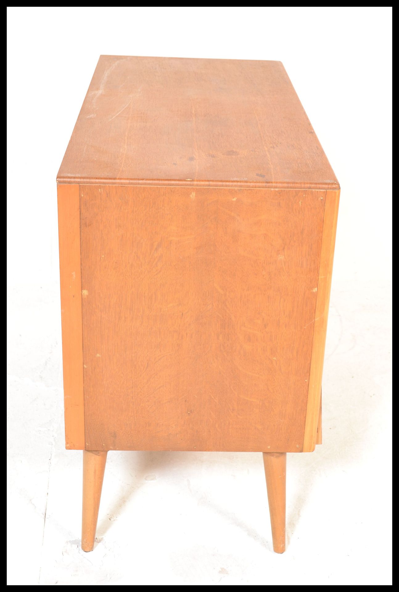 A vintage retro mid 20th Century teak wood Beehive fronted chest of drawers having a bank of three - Bild 8 aus 12