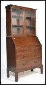 A good mid century1950's Gordon Russell mahogany bureau library bookcase being raised on cabriole