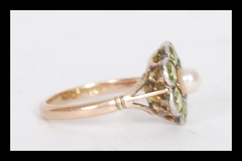 A stamped 9ct gold ring having a flower head seat with round cut peridots with a pearl to the - Image 2 of 4