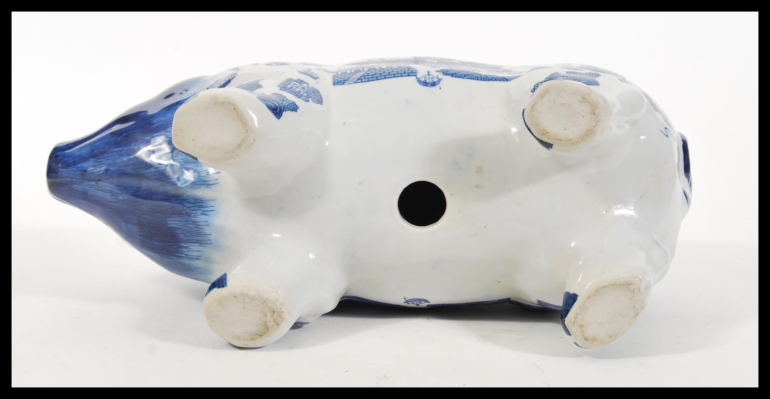 A vintage 20th Century large ceramic money bank box in the form of a pig having blue and white - Image 4 of 4