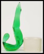 An early 20th Century green studio art glass figurine of a lady with feet raised and pointed being