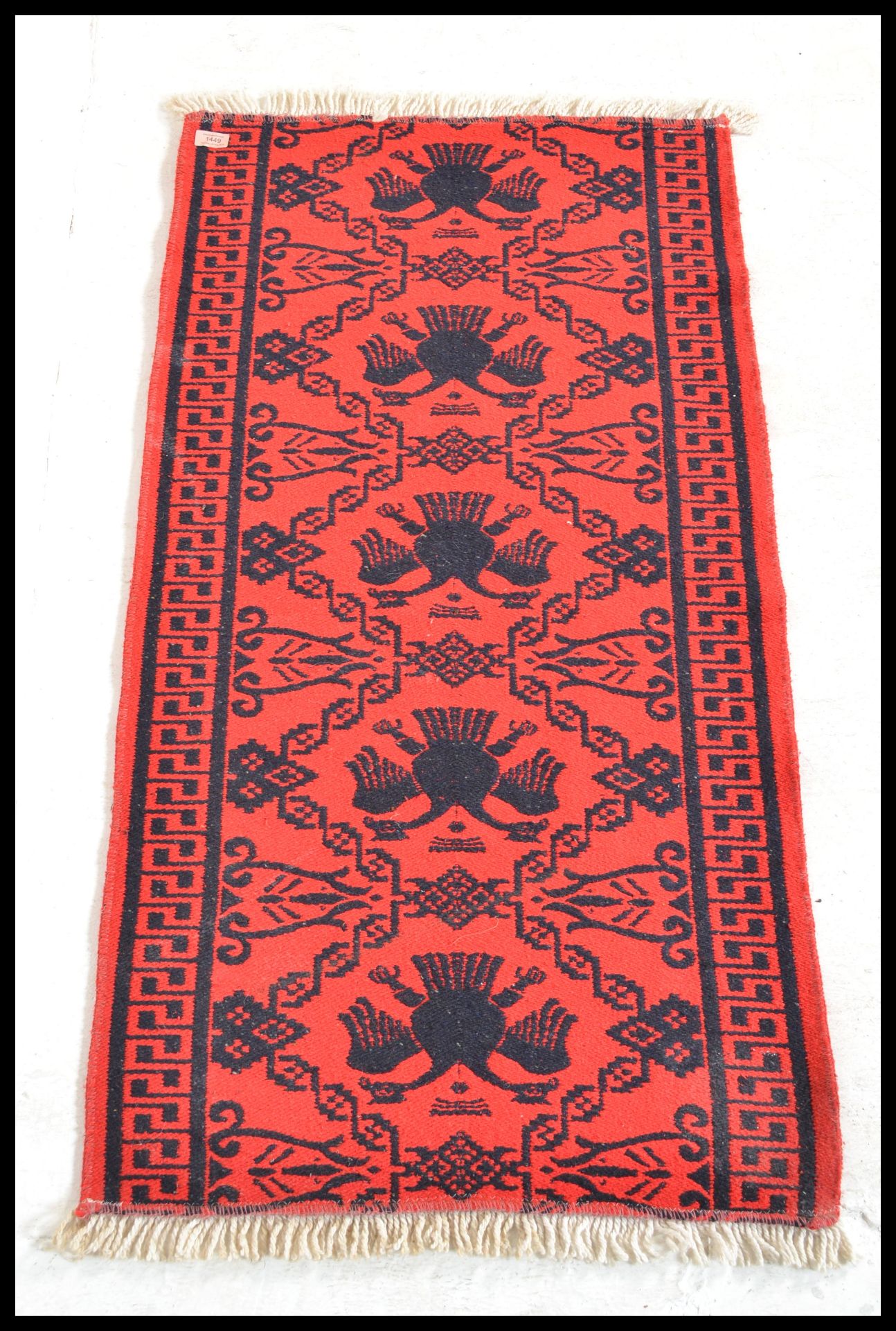 A vintage 20th Century Eastern European Russian / Albanian floor carpet rug having a red ground with - Bild 3 aus 3