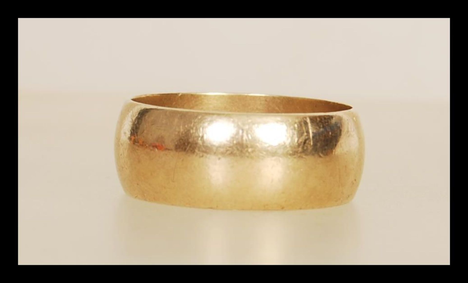 A 9ct gold wedding band ring having hallmarks for London dating 1975 and 375 stamped. Inside is