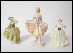 A group of three ceramic figurines to include a Karl Ens figurine of a dancing lady, stamped to base