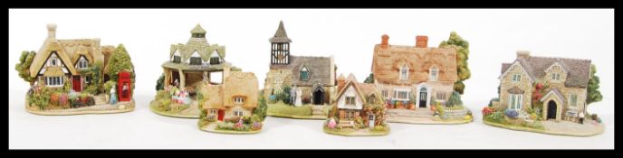 A collection of seven Lilliput lane ceramic cottages to include Chatterbox Corner, Playtime, Piggy