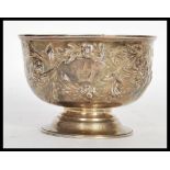 An early 19th Century Georgian hallmarked silver centerpiece table bowl having later clobbered