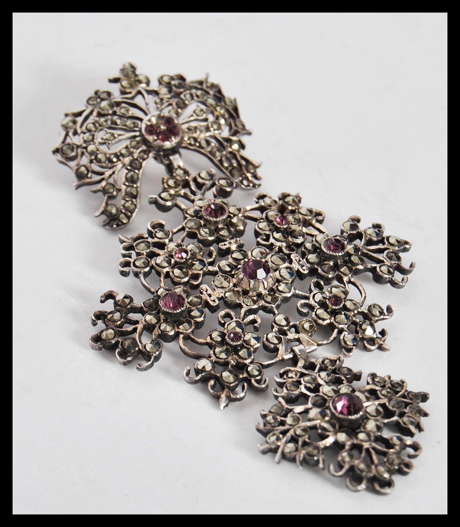 A late 19th / early 20th Century silver pendant, set with marcasites and pink paste in a floral - Image 2 of 3