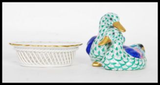 A 20th Century Herend Hungary figurine depicting two ducks having hand painted decoration and gilt