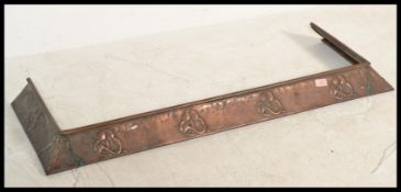 A late 19th Century Art Nouveau hand worked copper fender, in the manner of Newlyn, Art nouveau