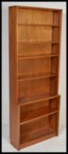 A 20th Century pine freestanding open fronted bookshelf of simple graduating form, having adjustable